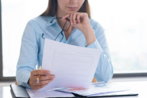 closeup-woman-holding-reading-document